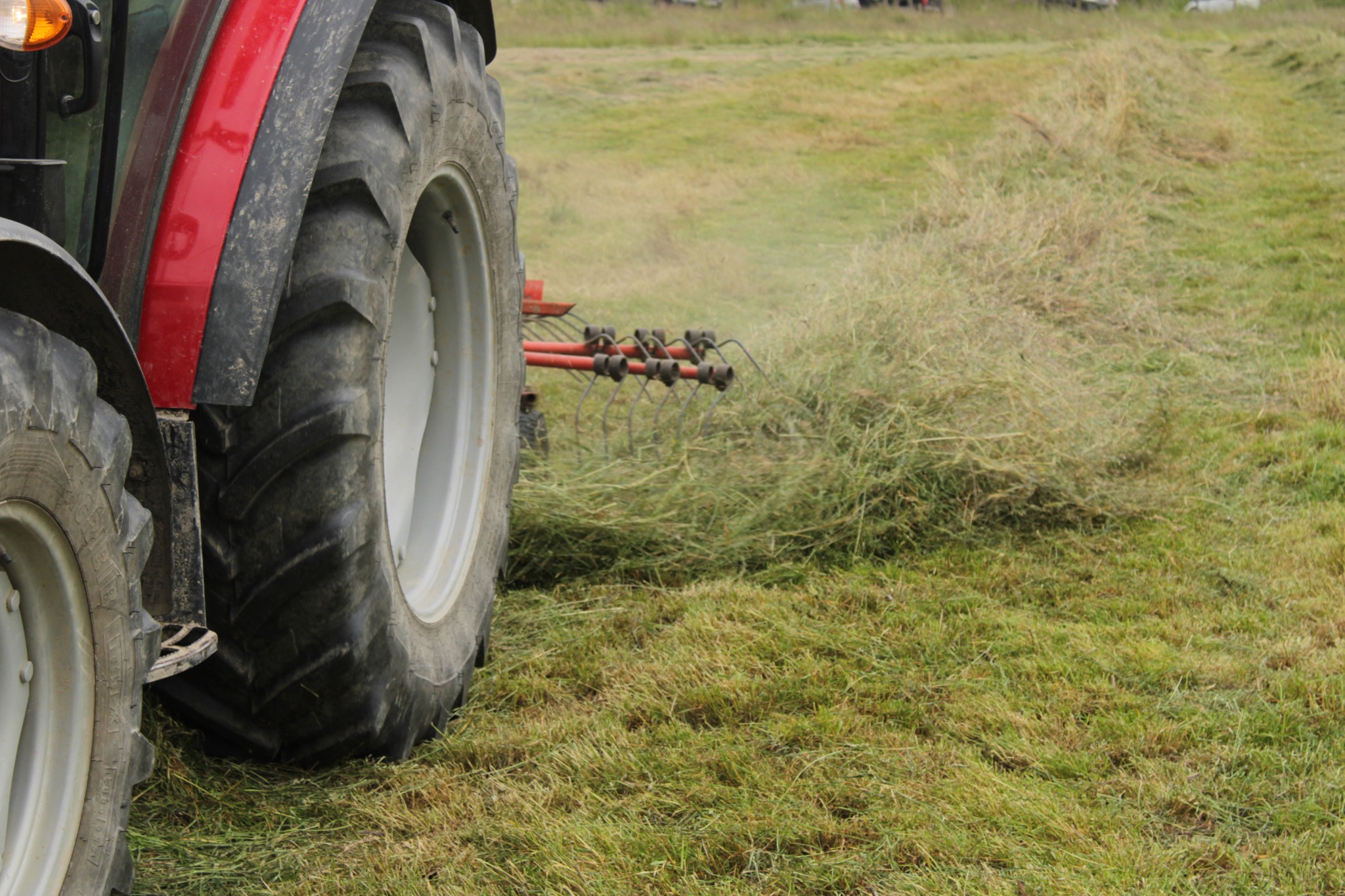 Tractor working a hay field